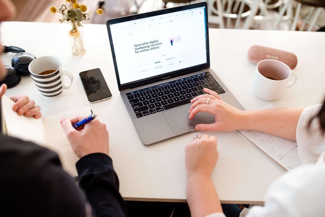A laptop showing a website design in progress.