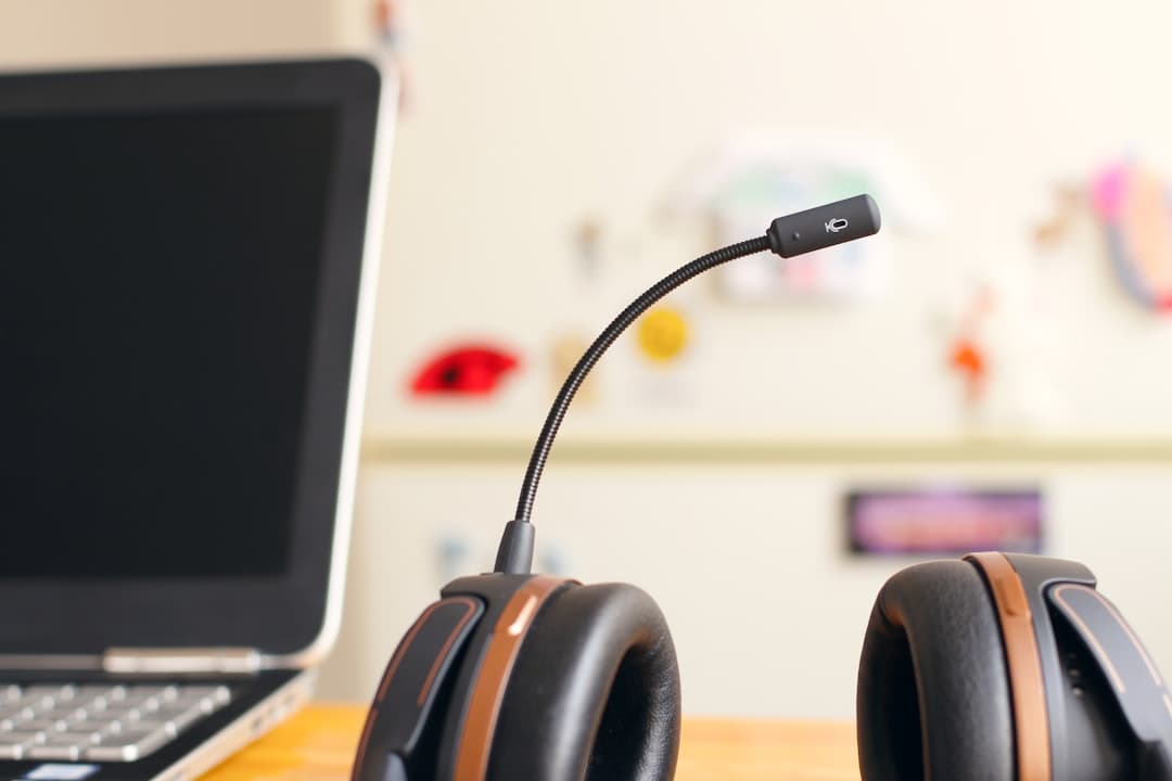 A headset resting on a desk in a call-handling office.